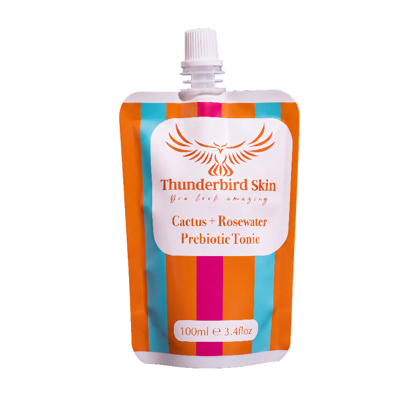 Thunderbird Skin Cactus + Rosewater Prebiotic Tonic in a 100ml refill pouch with a white cap, featuring orange, teal, and magenta vertical stripes on a white background.