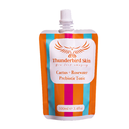 Thunderbird Skin Cactus + Rosewater Prebiotic Tonic in a 100ml refill pouch with a white cap, featuring orange, teal, and magenta vertical stripes on a white background.