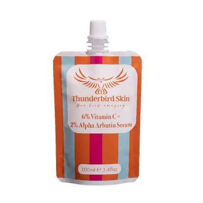 A 100ml refill pouch of Thunderbird Skin serum with a white cap, featuring orange and light blue vertical stripes with a central white label.