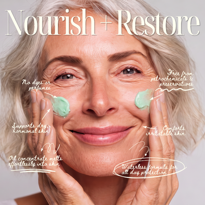 A smiling older woman with light gray hair applies Wild Crafted Repair Balm to both cheeks, with handwritten callouts and the large title 'Nourish + Restore' over a soft light gray background.